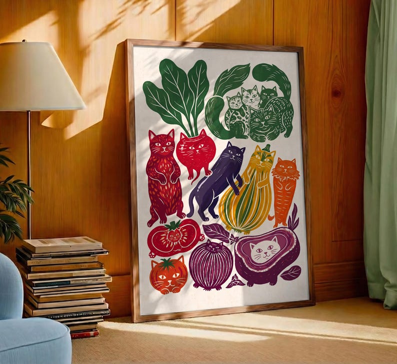 May include: A framed rectangular art print featuring a whimsical illustration of various cats integrated with vegetables and fruits. The colorful design includes red, green, purple, orange, and yellow stylized cats shaped like produce on a white background.