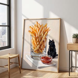 May include: A framed painting depicts a glass of golden french fries, a small bowl of ketchup, and a black cat. The artwork is set against a neutral background, with a white napkin under the ketchup bowl.