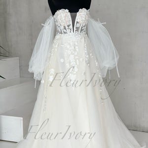 Robe de mariée de conte de fées Robe de mariée romantique Robe de mariée à fleurs Robe de mariée à épaules dénudées Robe de mariée amovible à manches bouffantes