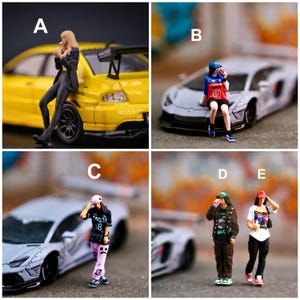May include: A collection of five miniature figurines labeled A through E, depicting individuals in casual streetwear. Figure A leans on a yellow sports car. Figure B sits on a grey sports car. Figures C, D, and E stand near a grey sports car.
