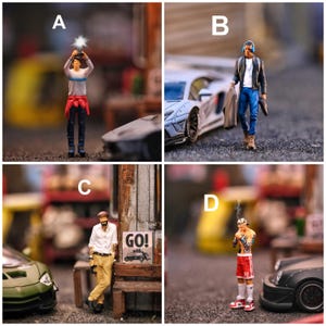 May include: Four miniature figurines labeled A, B, C, and D. A shows a person holding a glowing object. B shows a person with headphones walking by a white car. C shows a person leaning against a wooden structure with a sign reading GO!. D shows a person smoking.