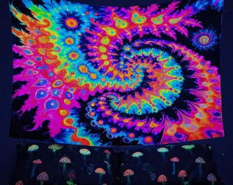 May include: A psychedelic tapestry with a swirling, tie-dye pattern in shades of pink, blue, yellow, and orange. The tapestry is hanging on a dark blue wall above a bed with a black and white mushroom print.