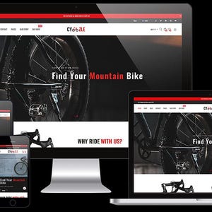 Może przedstawiać: Strona główna witryny internetowej sklepu rowerowego o nazwie Cycle. Witryna internetowa ma czarno-czerwoną kolorystykę z dużym obrazkiem roweru górskiego. Tekst "Find Your Mountain Bike" jest wyświetlany na czerwono na stronie internetowej. Witryna internetowa zawiera również sekcję zatytułowaną "Why Ride With Us?"