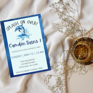 May include: A party invitation with a blue border and a dolphin illustration. The text reads "Splash On Over! Camden turns 1" with event details: Sunday, May 15, 10 AM, at The Aquarium, Poolside, VA. RSVP information is included.