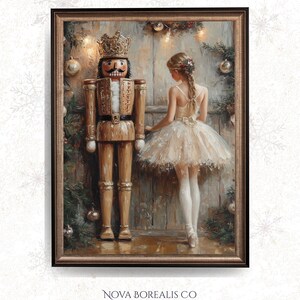 May include: A framed painting depicting a wooden nutcracker and a ballerina in a tutu, set against a backdrop of Christmas decorations. The artwork has a warm colour scheme and includes the text "NOVA BOREALIS CO".