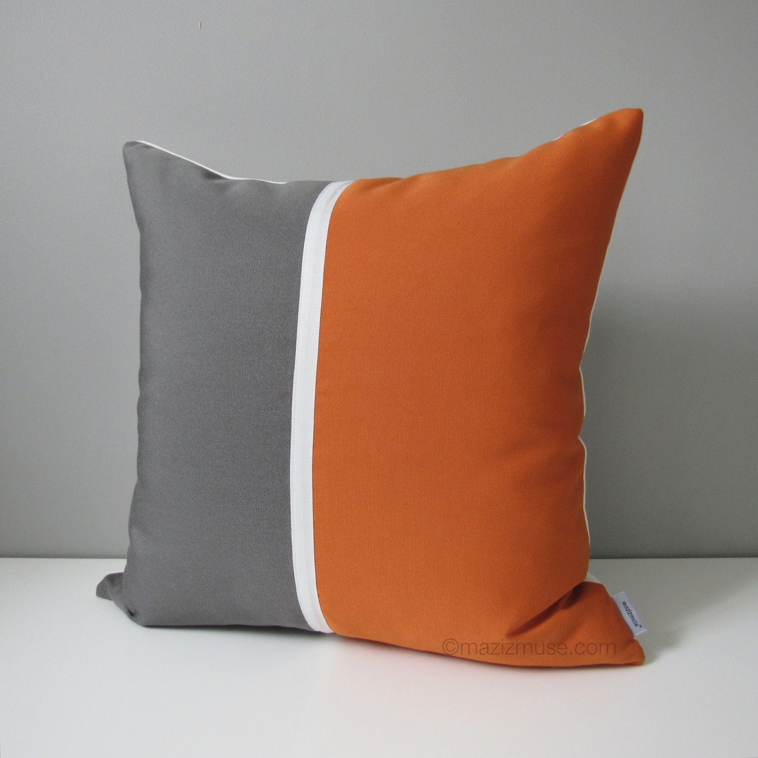 orange and grey outdoor pillows