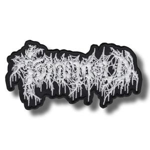 May include: Embroidered patch with the word "Gorged" in white, stylized, dripping font. The patch has a black border and a white background. The design has a gothic or metal aesthetic.