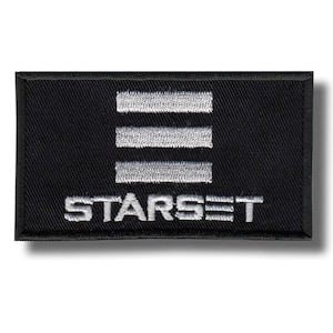 May include: A black rectangular patch featuring the word "STARSET" embroidered in white beneath three horizontal white lines. The patch has a black border and a shadow.