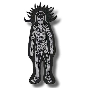May include: Black embroidered patch featuring a stylized human figure with a skeleton design. The figure has a skull head and a detailed depiction of the skeletal and circulatory systems. The patch has a spiky halo-like design around the head.