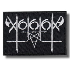 May include: Black rectangular patch with white embroidered design. The design includes the number 6 repeated three times, a pentagram, and other stylized symbols. The patch has a black border and is likely for clothing or accessories.