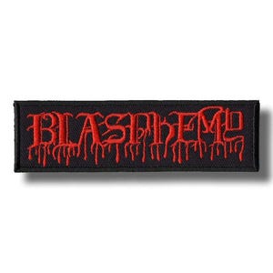 May include: Black rectangular patch with the word "BLASPHEME" embroidered in red, dripping letters. The patch has a black border and is likely designed to be sewn onto clothing or accessories. The design has a gothic or heavy metal aesthetic.