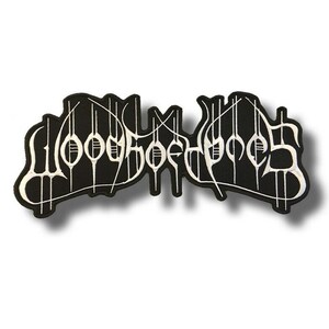 May include: A black and white embroidered patch with the band name "Hooded Gods". The text is in a gothic font with white stitching on a black background. The patch has a white border and a symmetrical, detailed design.