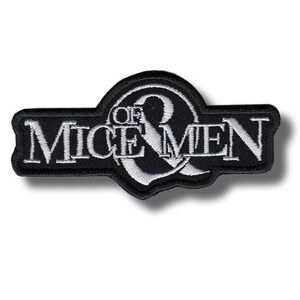 May include: Black and white embroidered patch featuring the text "OF MICE & MEN" in a stylized font. The patch has a rectangular shape with a curved top and is likely for clothing or accessories.