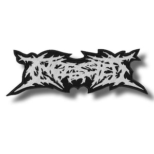 May include: A black and white embroidered patch with a stylized, jagged design. The patch features a complex, abstract pattern in white against a black background. The edges are sharply defined, creating a bold, graphic look. Ideal for jackets, bags, or other fabric items.