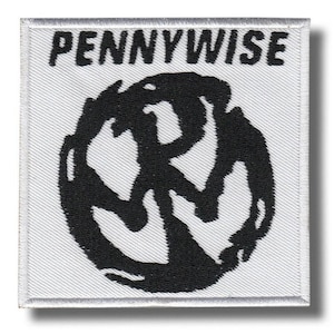 May include: Square white patch with the word "PENNYWISE" in black, block letters at the top. Below the text is a black, abstract design. The patch has a white border and is likely an iron-on or sew-on patch.