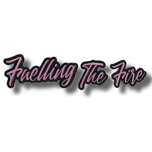 May include: A pink embroidered patch with the words "Fuelling The Fire" in a cursive script. The text has a black outline, giving a 3D appearance. The patch is displayed on a white backdrop.