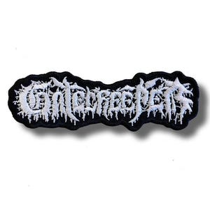 May include: A black embroidered patch with the word "Contrecoup" in white, stylized, gothic lettering. The patch has a black border and a white, textured design. The patch is likely for clothing or accessories.
