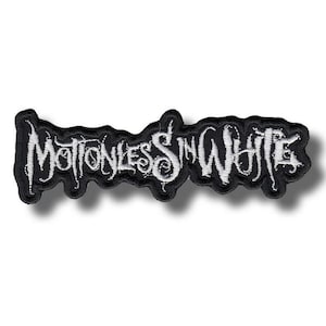 May include: An embroidered patch with the words "Motionless In White" in a gothic font, in white against a black background. The patch is designed to be sewn onto clothing or bags.