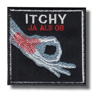 May include: Black square patch with white embroidered text "ITCHY JA ALS OB" and a hand gesture with a red, itchy area. The hand is in a circle gesture, with the thumb and index finger touching.
