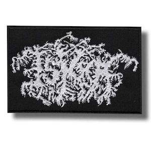 May include: Black rectangular patch with a white, intricate, abstract design. The design appears to be embroidered and has a textured appearance. The patch is likely for clothing or accessories.