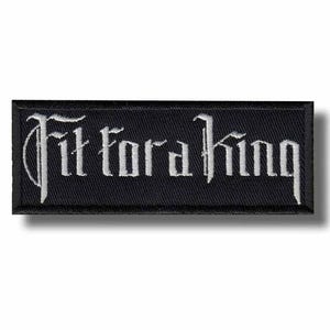 May include: Black rectangular patch with the embroidered text "Fit for a King" in white gothic lettering. The patch has a black border and is likely designed to be sewn or ironed onto clothing or accessories.