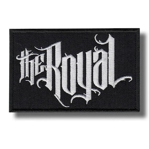 May include: Black rectangular patch with white embroidered text reading "the Royal" in a gothic font. The patch has a black border and a shadow effect.