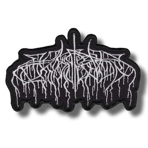 May include: Black embroidered patch with white stylized text. The text appears to be a band logo or similar design, with a gothic or metal aesthetic. The patch has a black border and a white background.