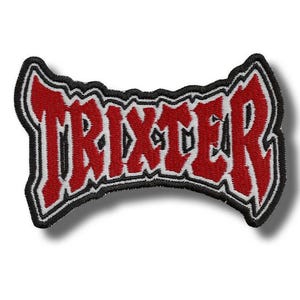 May include: Embroidered patch with the word "TRIXTER" in red, outlined in white and black. The patch has a unique, curved shape and is designed to be sewn or ironed onto fabric. The text is in a bold, stylized font.