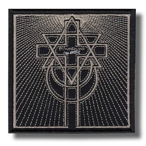 May include: Square black patch with a detailed silver embroidered design. The design features a cross, a six-pointed star, and a crescent moon, with radiating lines emanating from the center. The patch has a black border.