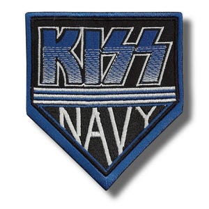 May include: A navy blue and black embroidered patch with the word "KISS" in blue and white, above the word "NAVY" in white. The patch has a blue border and a shield shape.