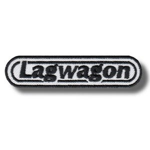 May include: Embroidered patch featuring the word "Lagwagon" in black, stylized text. The patch has a white background with a black border, and a shadow effect. The patch is rectangular with rounded corners.