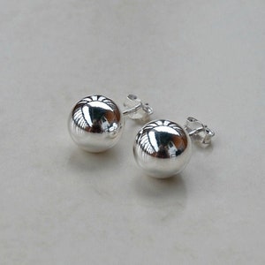 Large silver ball stud earrings top