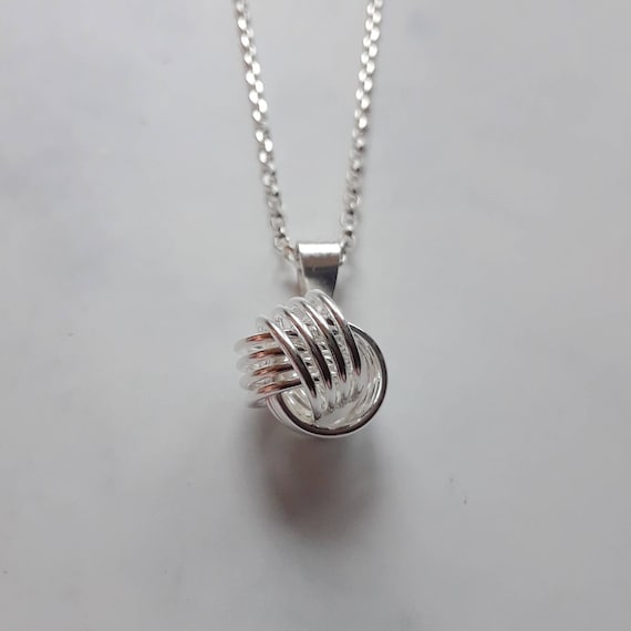 Sterling silver love knot pendant necklace