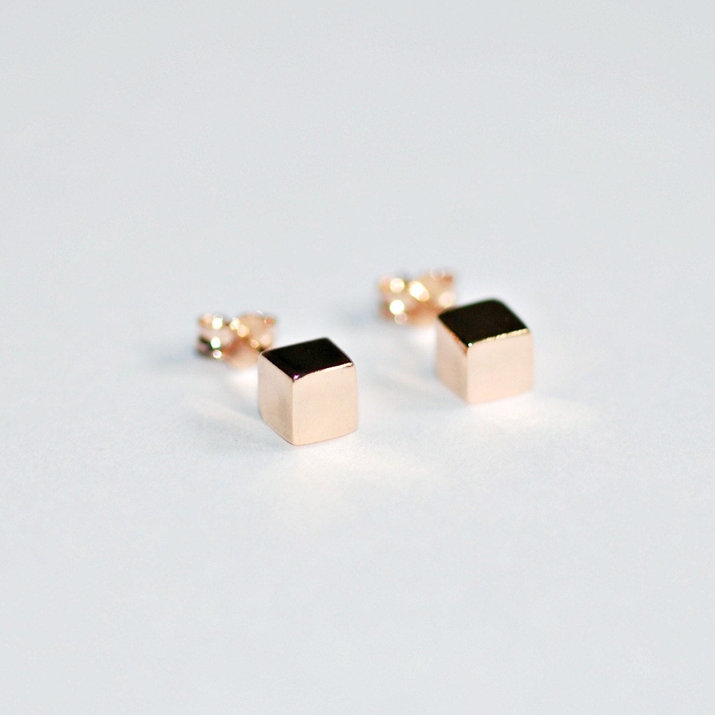 Gold cube 2024 stud earrings