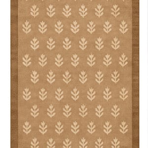 a rug with a repeating pattern of white leaf-like designs on a beige background.