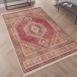 Alfombra turca vintage: Alfombra lavable con estampado de medallón rosa.