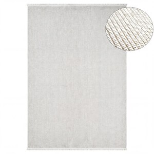 a large, plain grey rug with a fringed edge.