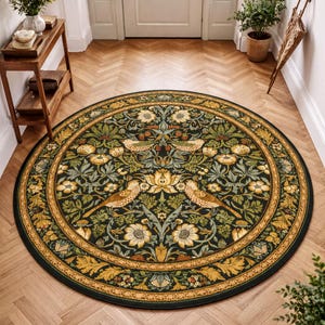 a large, ornate rug with a floral design in shades of green and gold, placed on a wooden floor in a hallway. The rug is surrounded by potted plants and a wooden table, creating a cozy and inviting atmosphere.