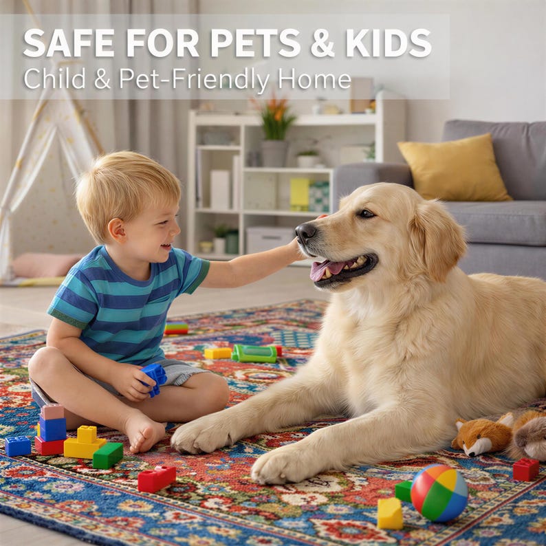 A young boy in a blue striped shirt is playing with a golden retriever dog on a colorful rug in a cozy living room.