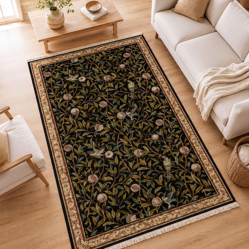 a living room with a large rug with a floral design, a white sofa, a wooden coffee table, and a potted plant.