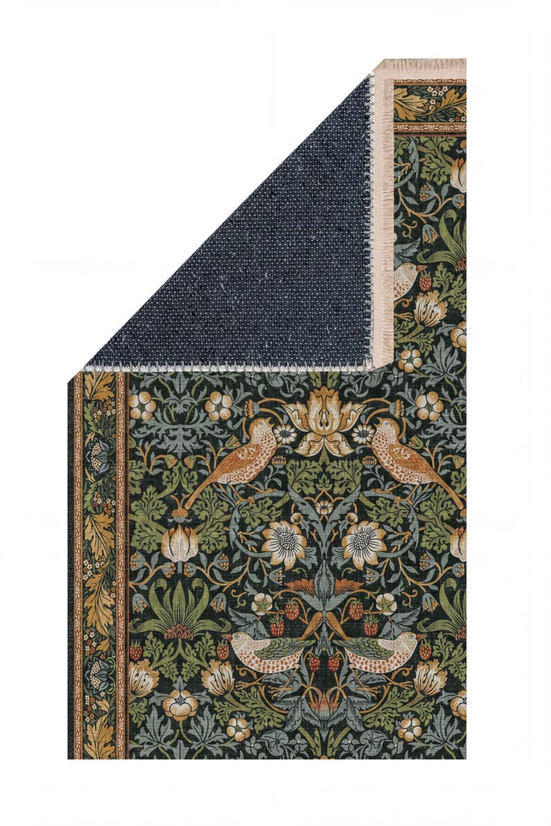 a detailed tapestry with a floral and bird motif, including various shades of green, orange, and white. The tapestry is folded in half, revealing a dark blue background.