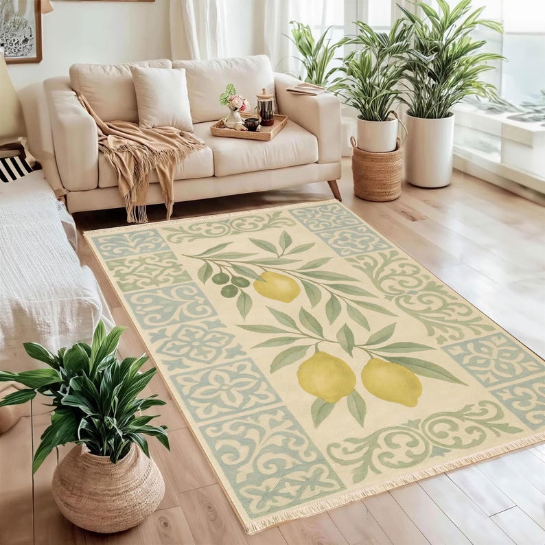 a cozy living room with a large rug featuring a lemon design, a white sofa, and several potted plants.