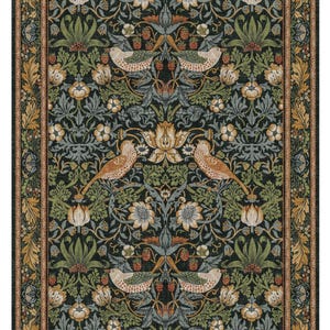 a large, ornate rug with a floral and bird motif. The rug has a dark green background with intricate floral patterns and birds in shades of brown and white. The rug is framed by a gold border, adding to its decorative and luxurious appearance.