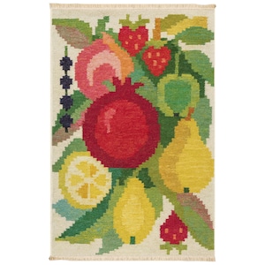 May include: A rectangular rug with a colorful fruit design. The rug features a large red pomegranate, strawberries, pears, and a lemon. Green leaves and a cream-colored background complete the design. The rug has a fringed edge.