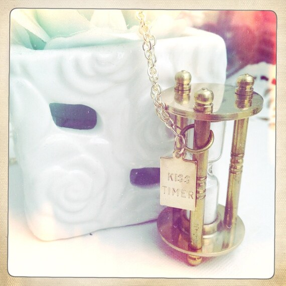 Items similar to Kiss Timer . hour glass charm necklace in gold on Etsy