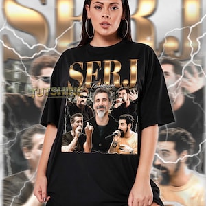 May include: Black unisex t-shirt featuring a collage of images and the name "SERJ" in gold lettering. The shirt includes the text "TUTSHING" and a description of the shirt's fit. The model is wearing a 2XL.
