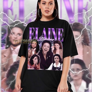 May include: Black unisex t-shirt featuring a collage of images and the name "Elaine Benes" in purple. The shirt has a vintage style with a faded background and lightning bolt graphics. The model is wearing a size 2XL.