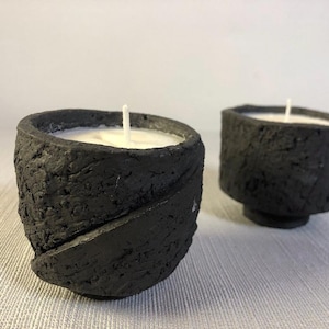Set of two handmade black stoneware candlesticks. Unique pieces. Japanese inspiration, work with cut sides, very rough earth