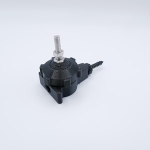 May include: A black, 3D-printed component with a threaded metal bolt and nut. The component has a circular base with a series of ridges and a screw extending from the side. The object is set against a white background.