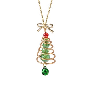 May include: Gold-toned Christmas tree pendant necklace. The pendant features a spiral design with green beads, a red bead at the top, and a green bell at the bottom. The necklace has a gold chain and a bow detail at the top.